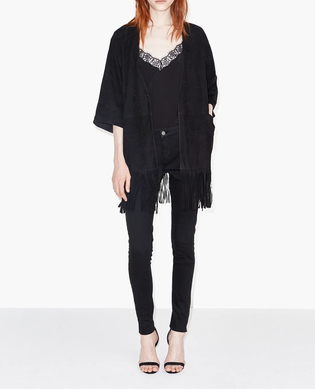 Poncho en daim à franges et détails ajourés